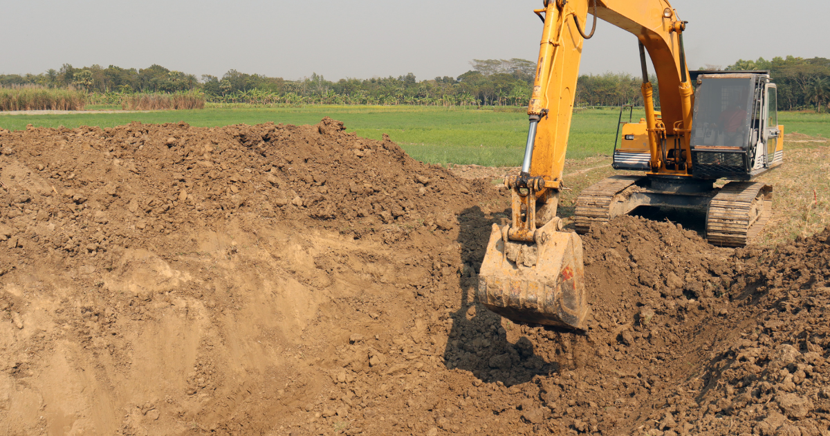 Excavator digging on a job site